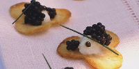 Cauliflower Purée and Caviar on Cloverleaf Potato Chips ... image