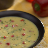 Fresh Corn & Red Pepper Bisque Recipe | EatingWell image
