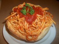 Spaghetti Filled Bread Bowls | Just A Pinch Recipes image