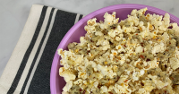 Garlic Parmesan Popcorn Recipe – PureWow image