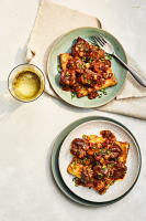 Grit Cakes with Pork Grillades | Southern Living image