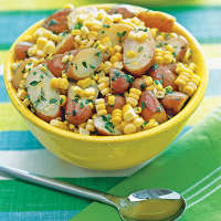 Herb Buttered Potatoes and Corn Recipe | MyRecipes image