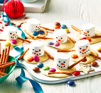 Melted snowman giant buttons recipe | BBC Good Food image