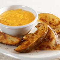 Roasted Potatoes with Cheddar Sauce Recipe | U.S. Dairy image