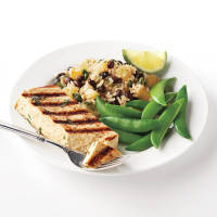 Caribbean Tofu with Black Beans and Rice Recipe | EatingWell image