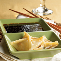 Pork Dumplings with Tangy Dipping Sauce Recipe | MyRecipes image