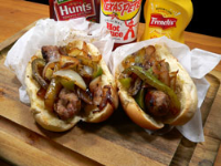Sausage Dogs with Peppers and Onions Recipe : Taste of ... image