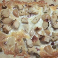 White Pizza with Roasted Garlic and Green Olives Recipe ... image