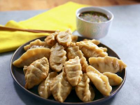 Chicken Pot Stickers with Dipping Sauce - foodnetwork.com image