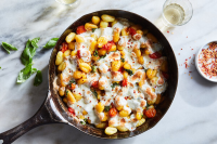 Recipes and Cooking Guides From The New York Times - NYT Cooking - Crispy Gnocchi With Burst Tomatoes and Mozzarella Recipe - NYT Cooking image