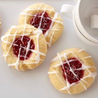 Raspberry Thumbprint Cookies with Almond Glaze - Land O'Lakes image