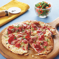 Thin-Crust Turkey Pepperoni Pizzas Recipe | MyRecipes image