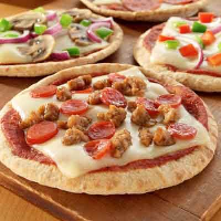 Mini Pita 4 Cheese Pizzas Recipe | Land O’Lakes image
