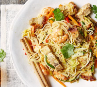 Spicy Singapore noodles recipe | BBC Good Food image