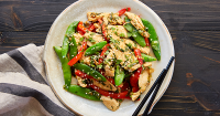 Chicken and Snap Pea Stir Fry Recipe - PureWow image