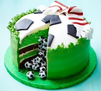 Surprise piñata football cake recipe | BBC Good Food image