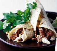 Chicken enchiladas with red mole sauce recipe | BBC Good Food image