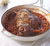 Herby baked lamb in tomato sauce recipe | BBC Good Food image