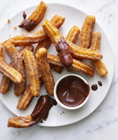 Churros With Chocolate Sauce Recipe | Real Simple image