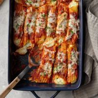 Cheese Manicotti Recipe: How to Make It - Taste of Home: Find Recipes, Appetizers, Desserts, Holiday Recipes & Healthy Cooking Tips image