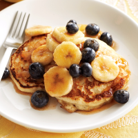Oatmeal Pancakes with Maple Fruit Recipe | EatingWell image