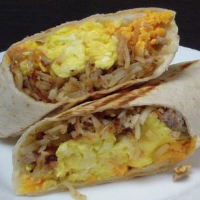 hash brown breakfast burrito with sausage, egg and cheese image