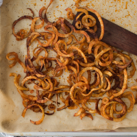Oven-Baked Curly Fries Recipe | EatingWell image