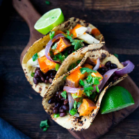 Roasted Vegetable & Black Bean Tacos Recipe | EatingWell image