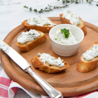 Goat Cheese-Garlic Toasts Recipe - Wolfgang Puck | Food & Wine image