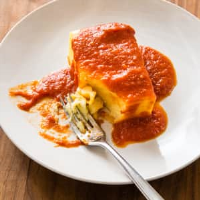 Fluffy Baked Polenta with Red Sauce | Cook's Country image