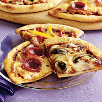 Individual Pizzas Recipe | MyRecipes image