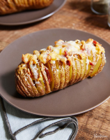 Baked Potato Recipe With Cheese and Bacon - PureWow image