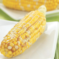 Lemon-Garlic Glazed Corn on the Cob Recipe | EatingWell image