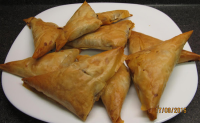 Greek Meat-Filled Triangles | Just A Pinch Recipes image