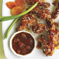 Thai Chicken Wings with Peanut Sauce Recipe | EatingWell image