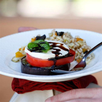 Grilled Eggplant & Tomato Stacks Recipe | EatingWell image