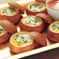 Baked Eggs in Bread Bowls Recipe | MyRecipes image