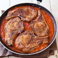 Pork Chops with Tomato Gravy | Cook's Country image