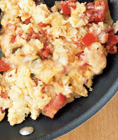 Eggs With Tortilla Chips, Salsa, and Cheese Recipe | Real ... image
