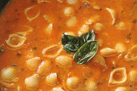 Tomato soup with pasta and basil Recipe | Good Food image