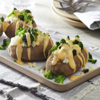 Cheesy Broccoli Baked Potatoes Recipe | EatingWell image