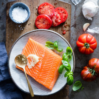 Grilled Salmon with Tomatoes & Basil Recipe | EatingWell image