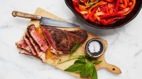 Seared Strip Steaks with Braised Peppers and Onion Recipe ... image