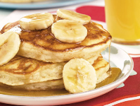 Banana Pancakes with Golden Banana Syrup | MrFood.com image
