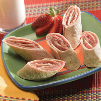 Peanut Butter and Jelly Roll-Ups Recipe | MyRecipes image