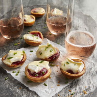 3-Ingredient Cranberry-Brie Bites Recipe | EatingWell image
