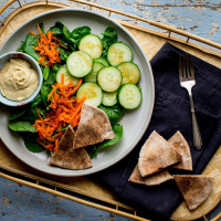 Green Salad with Pita Bread & Hummus Recipe | EatingWell image