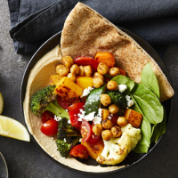 Piled-High Greek Vegetable Pitas Recipe | EatingWell image
