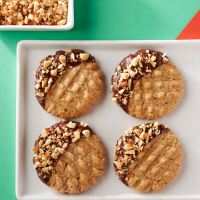 Chocolate-Dipped Peanut Butter Cookies Recipe | Land O’Lakes image