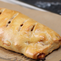 Sausage, Onion, and Peppers Pizza Roll Recipe by Tasty image